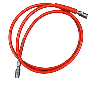 Coiled red hose with metal connectors on a white background